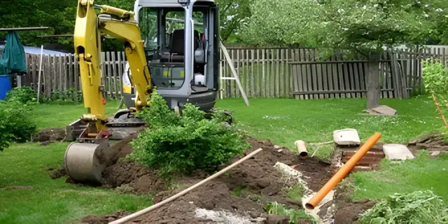 Compact excavator digging a sewer line in Christiansburg, VA